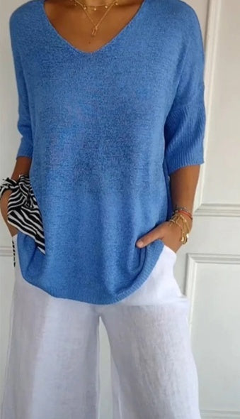 Plain knitted ladies' blouse with 3/4 sleeves and V-neck