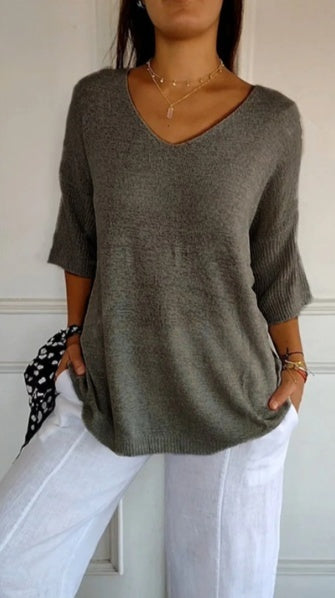 Plain knitted ladies' blouse with 3/4 sleeves and V-neck