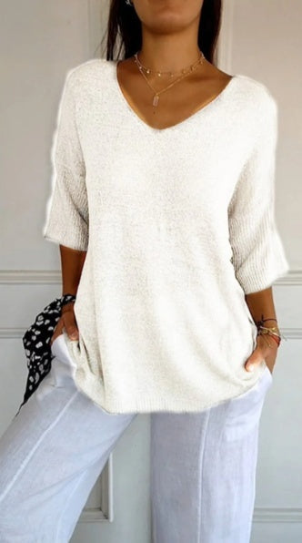 Plain knitted ladies' blouse with 3/4 sleeves and V-neck