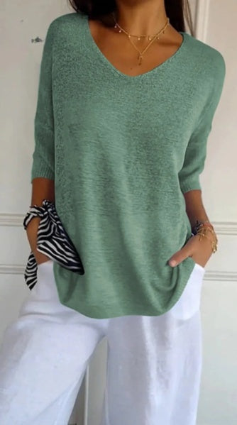 Plain knitted ladies' blouse with 3/4 sleeves and V-neck