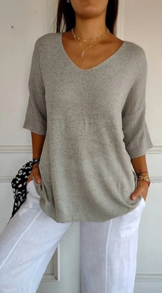 Plain knitted ladies' blouse with 3/4 sleeves and V-neck