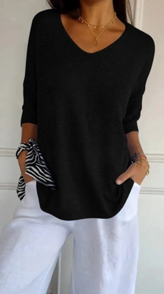 Plain knitted ladies' blouse with 3/4 sleeves and V-neck